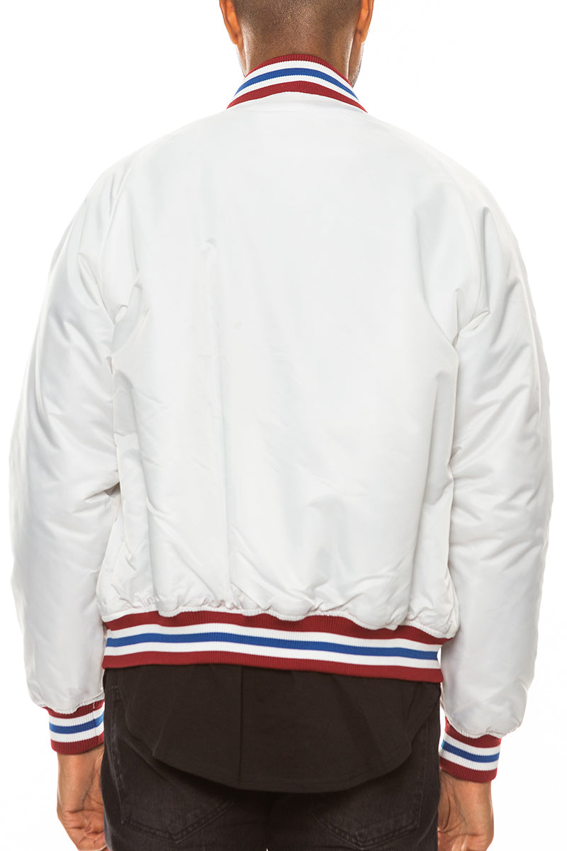 A stylish Classic Varsity Windbreaker featuring snap button closure and striped elastic details, perfect for casual wear.