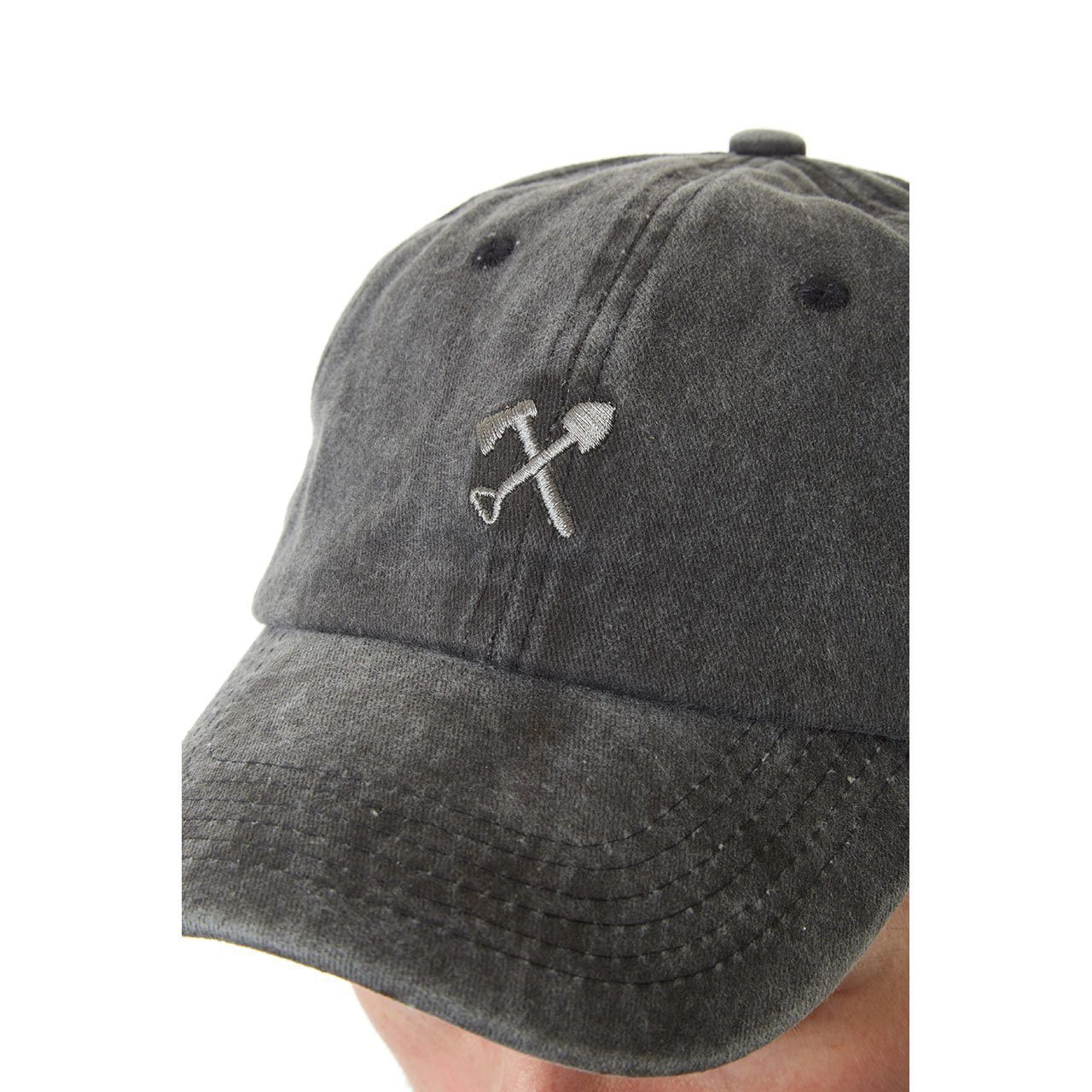 Cody Dad Hat featuring a curved brim, snow-washed finish, and embroidered shovel and ax logo, designed for comfort and style.