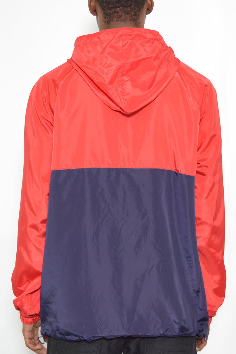 Color Block Anorak Jacket featuring a trendy design with flap pockets and quarter zip closure, modeled by a tall individual.