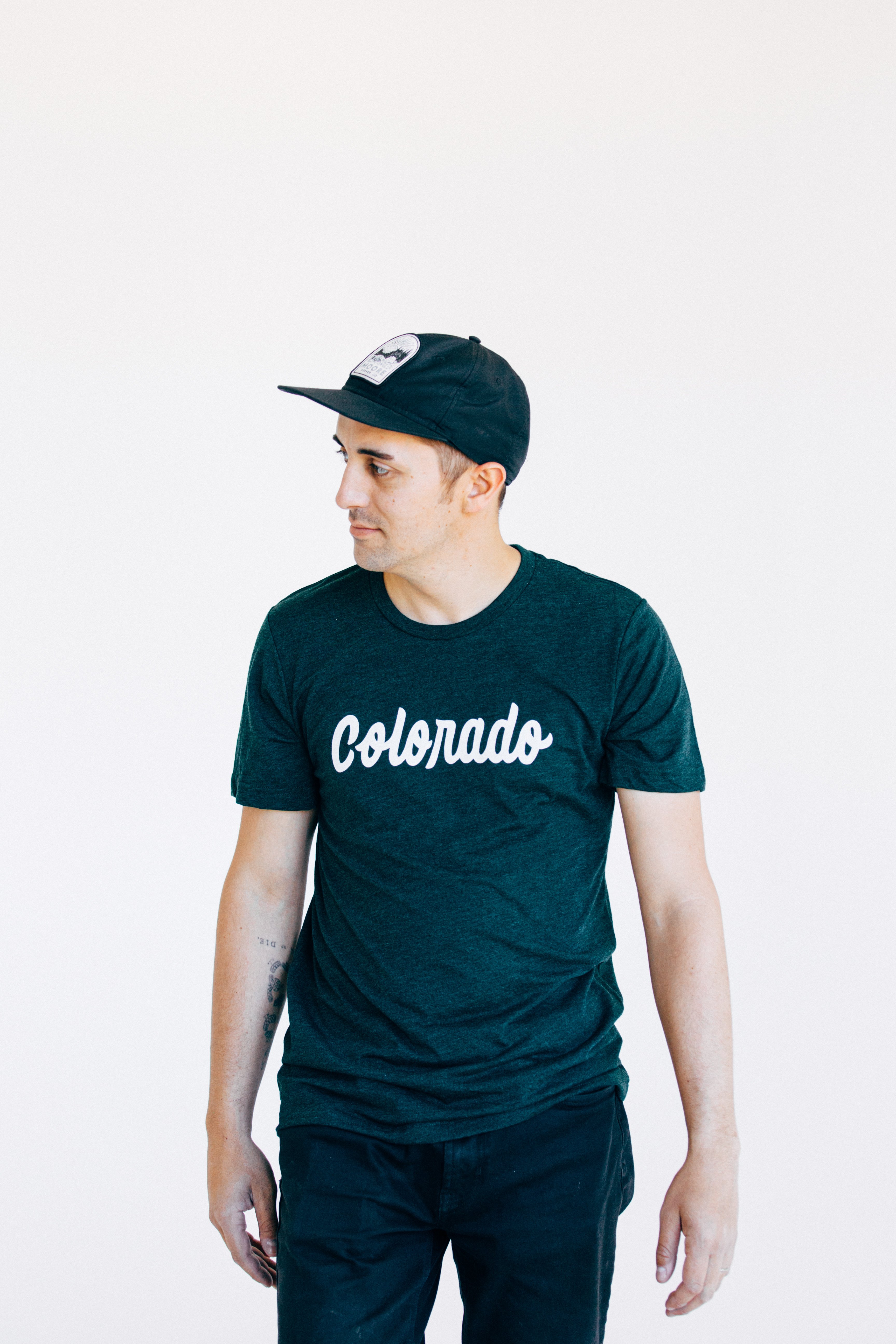 Emerald green Colorado Tee featuring hand lettering design, made from soft tri-blend fabric.