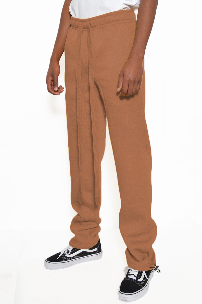 Cotton Fleece Toggle Sweats in a casual setting, showcasing the elastic waist and ankle toggle design.