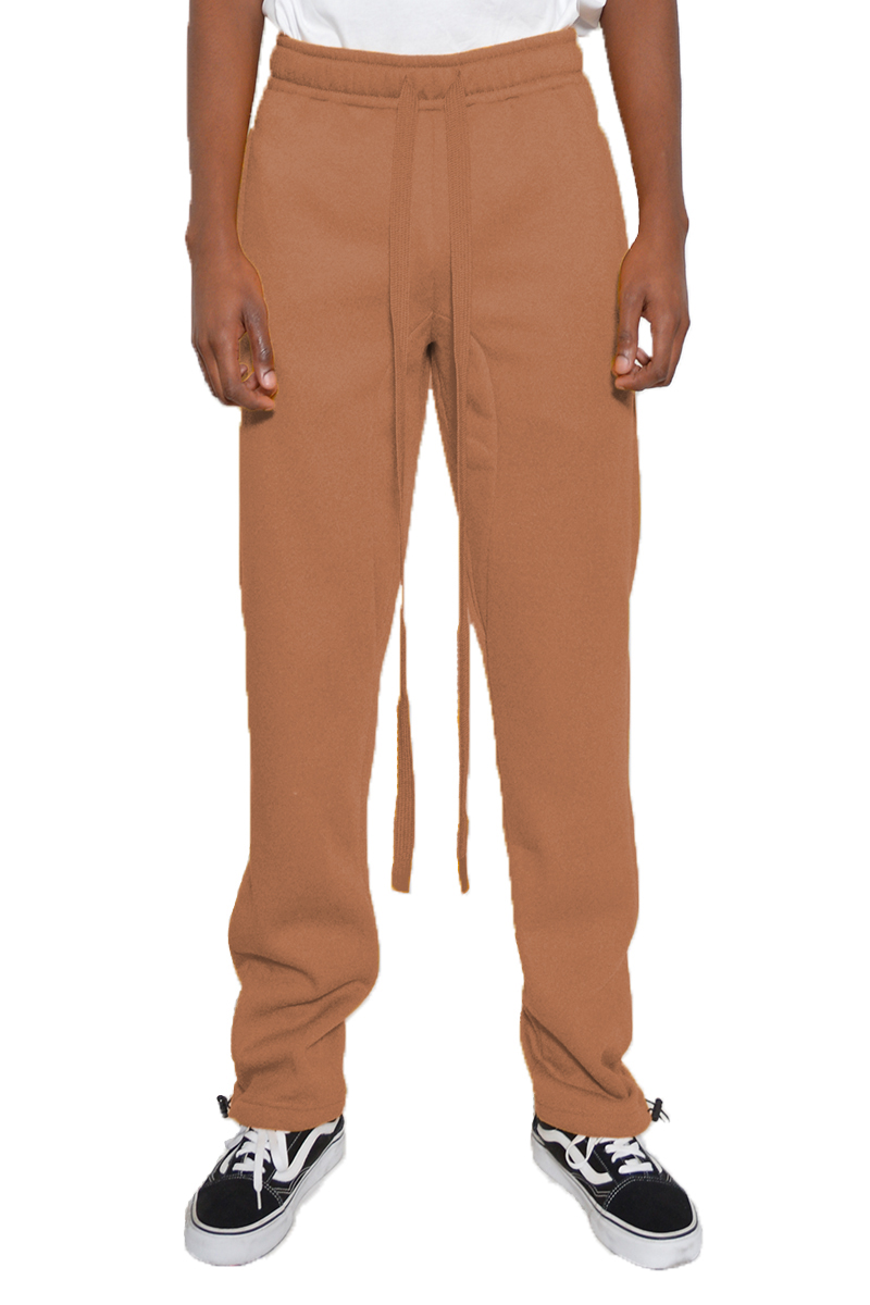 Cotton Fleece Toggle Sweats in a casual setting, showcasing the elastic waist and ankle toggle design.