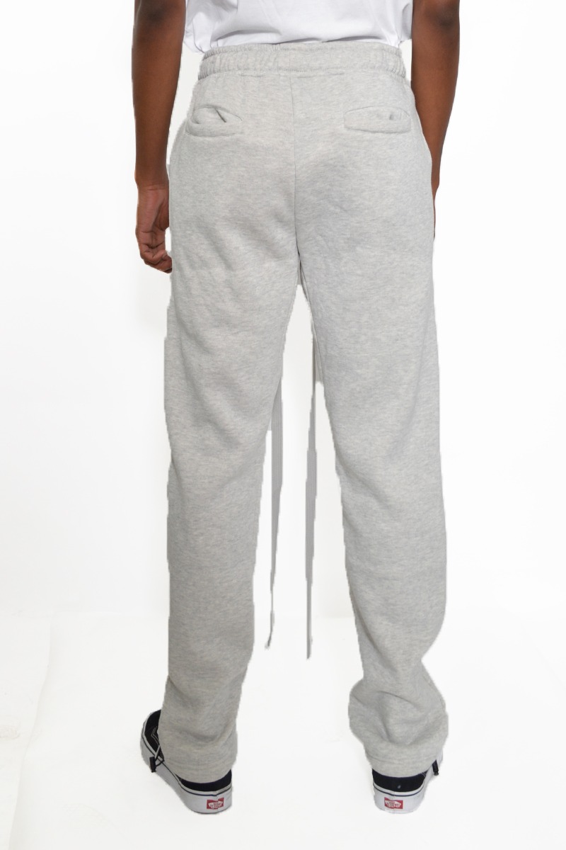 Cotton Fleece Toggle Sweats in a casual setting, showcasing the elastic waist and toggle ankle design.