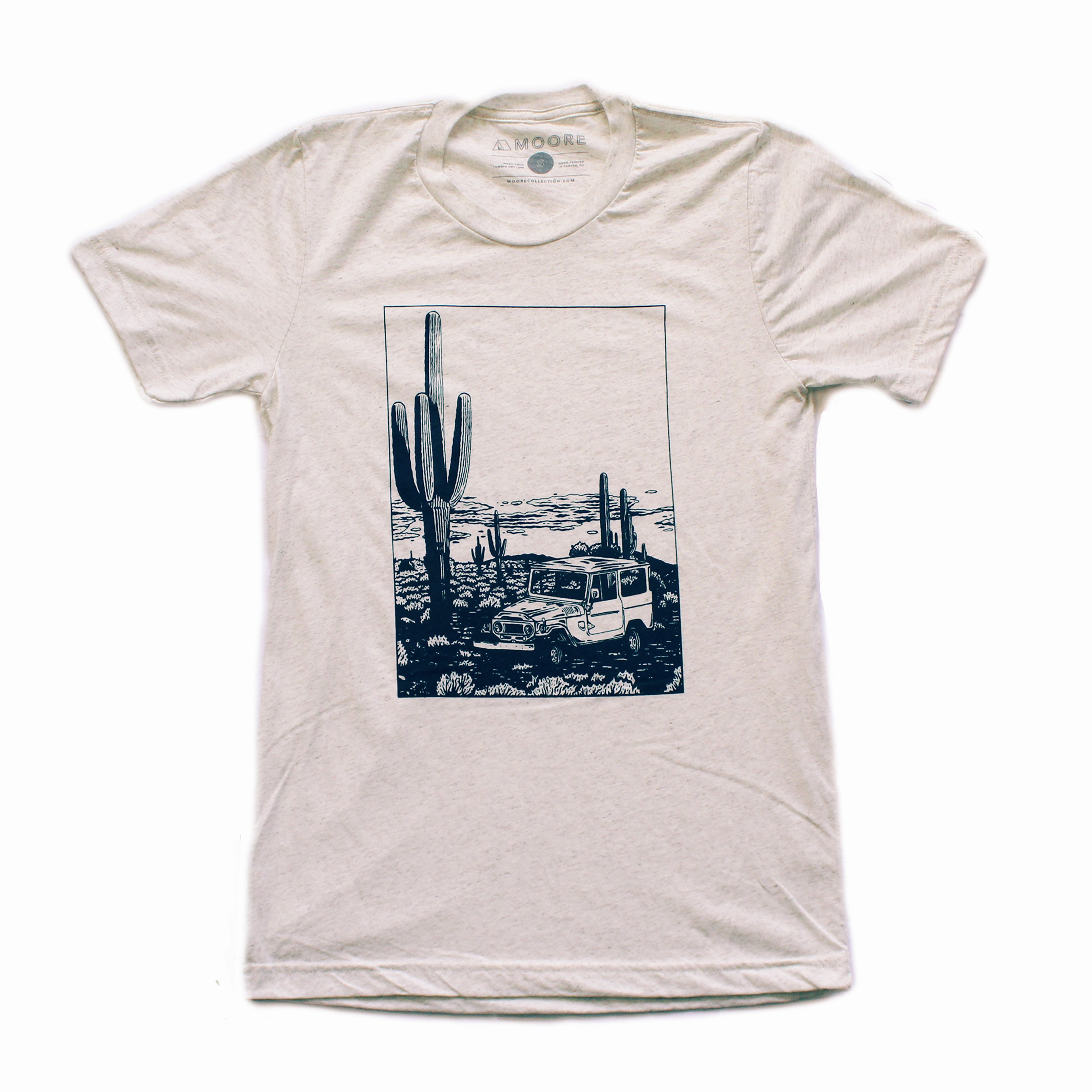 Desert Cruiser Tee in oatmeal color featuring a navy screen print design, showcasing a soft tri-blend fabric perfect for outdoor adventures.