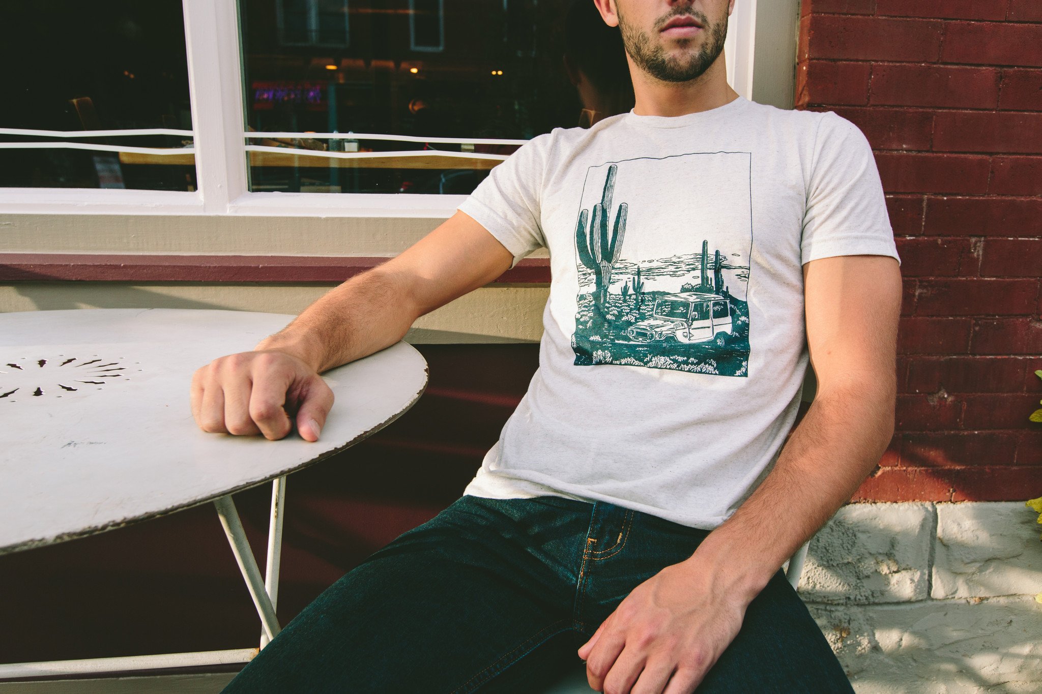 Desert Cruiser Tee in oatmeal color featuring a navy screen print design, showcasing a soft tri-blend fabric perfect for outdoor adventures.