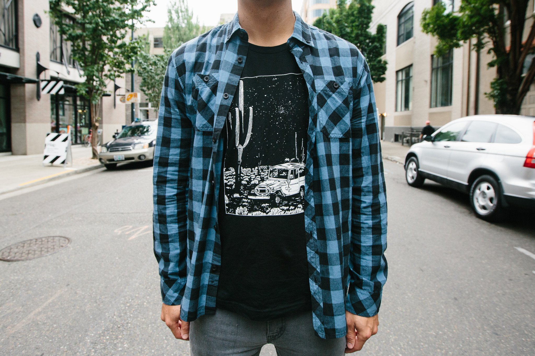 Desert Cruiser Tee in oatmeal color featuring a navy screen print design, showcasing a soft tri-blend fabric perfect for outdoor adventures.