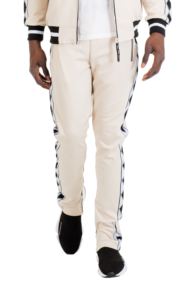 Diamond Lineage Track Pants featuring a slim fit design, ankle zippers, and multiple pockets, made from a durable polyester and spandex blend.