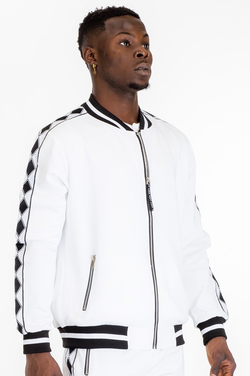 A stylish Diamond Tape Track Jacket featuring a diamond design tape on the sides, ribbed cuffs, and collar, perfect for casual and athletic wear.