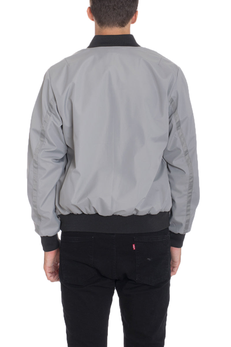 Dimple Bomber Jacket displayed on a model, showcasing its stylish design and front zip fastening.