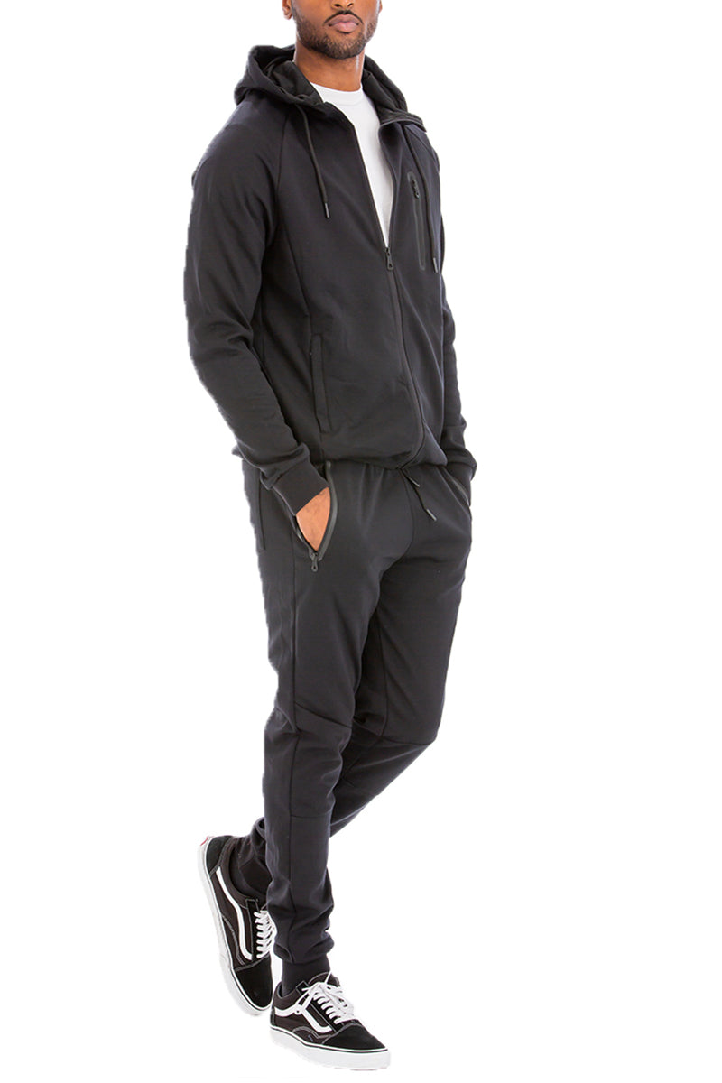 Dynamic Solid Sweat Set featuring a hooded top and elastic waist pants, designed for comfort and style.