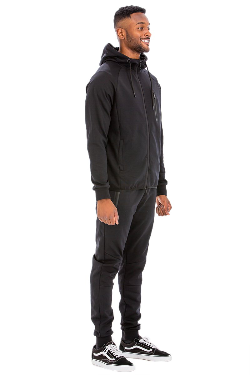 Dynamic Solid Sweat Set featuring a hooded top and elastic waist pants, designed for comfort and style.