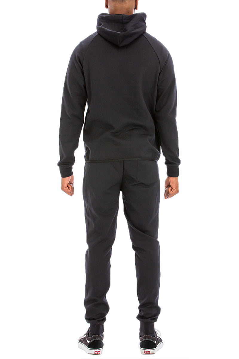 Dynamic Solid Sweat Set featuring a hooded top and elastic waist pants, designed for comfort and style.