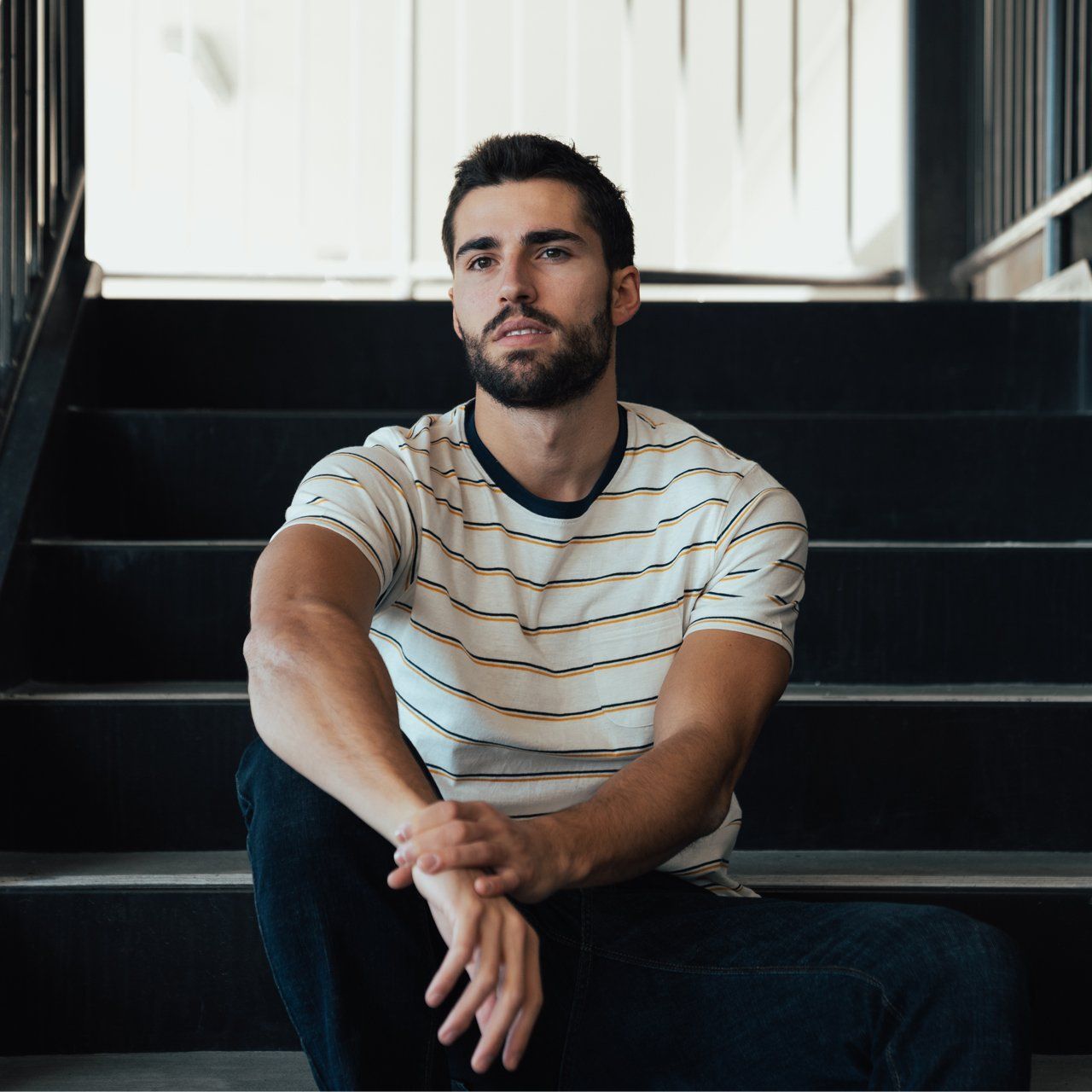 Edgar Striped Tee featuring yarn-dye stripes, chambray back yolk, and a patch pocket, made from 100% cotton.