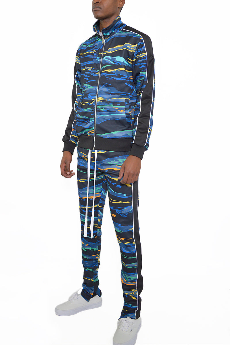 Edge Cut Track Suit featuring a skinny fit design with elastic waist, ankle zippers, and multiple pockets, made from polyester and spandex.