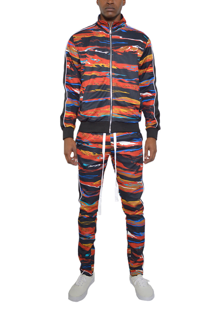 Edge Cut Track Suit featuring a skinny fit design with elastic waist, ankle zippers, and multiple pockets, made from polyester and spandex.