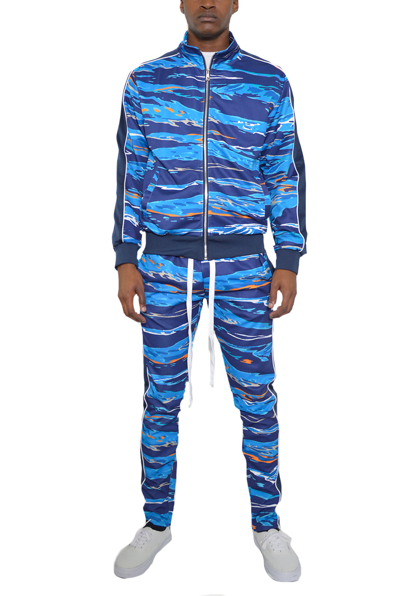 Edge Cut Track Suit featuring a skinny fit design with elastic waist, ankle zippers, and multiple pockets, made from polyester and spandex.