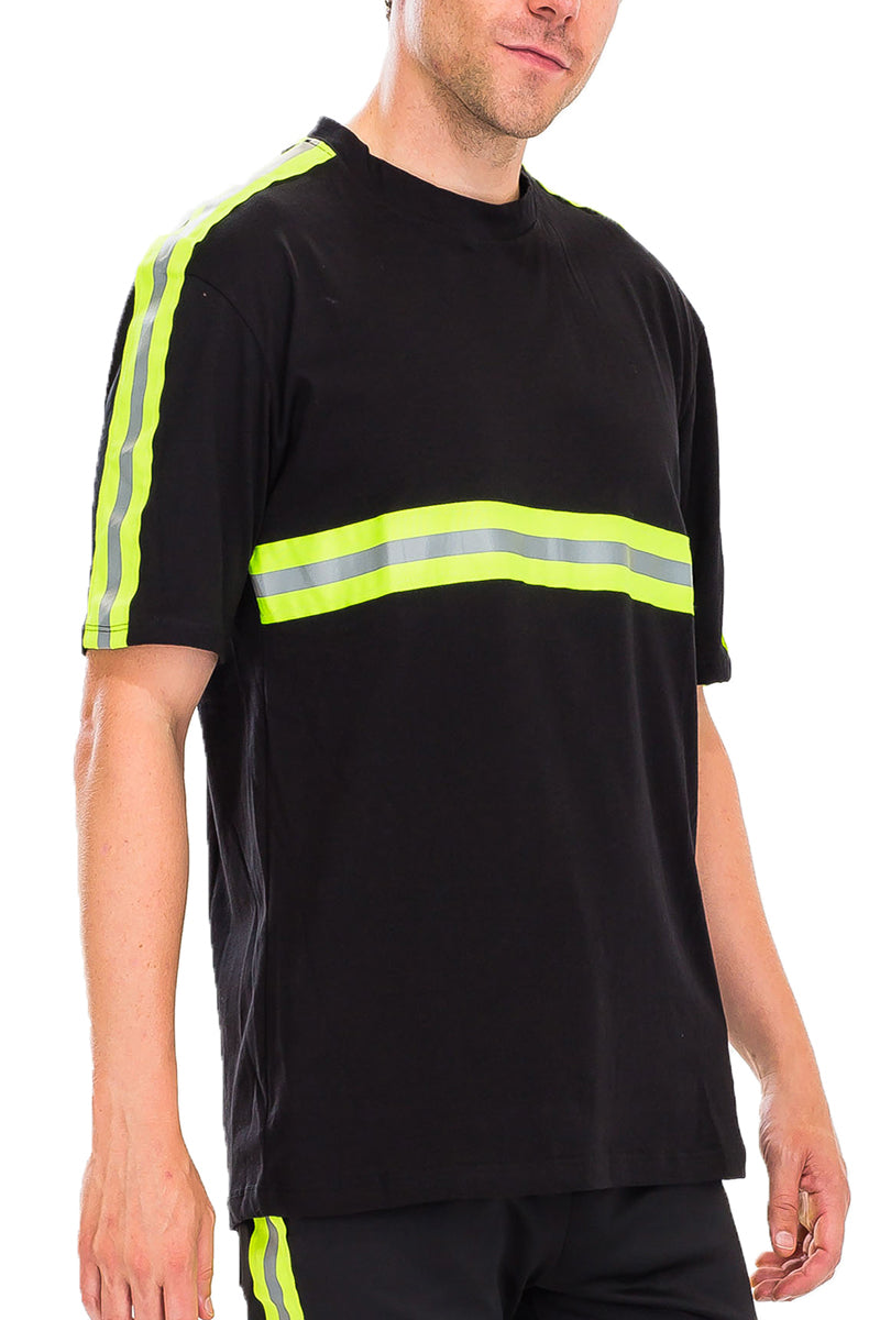 Element Reflective Tee showcasing reflective tape across chest and sleeves, made of 100% cotton, styled on a model.