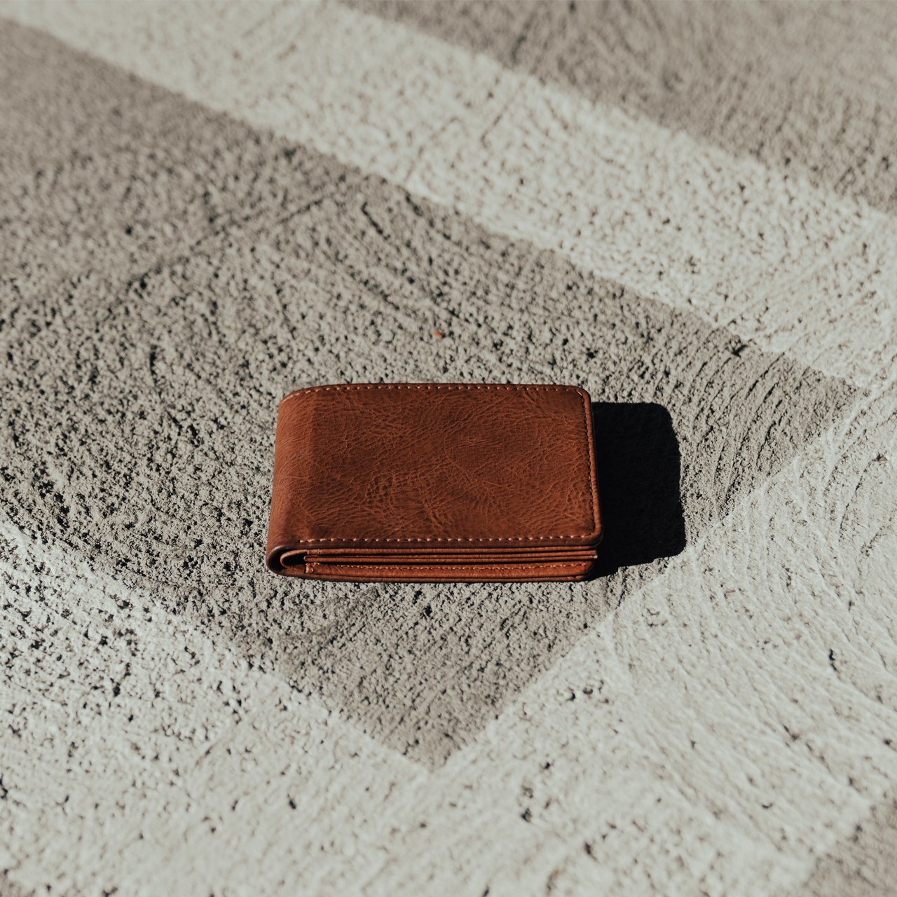 Evan Vegan Leather Bi-Fold Wallet featuring PX embossing, three card slots, and compact dimensions.