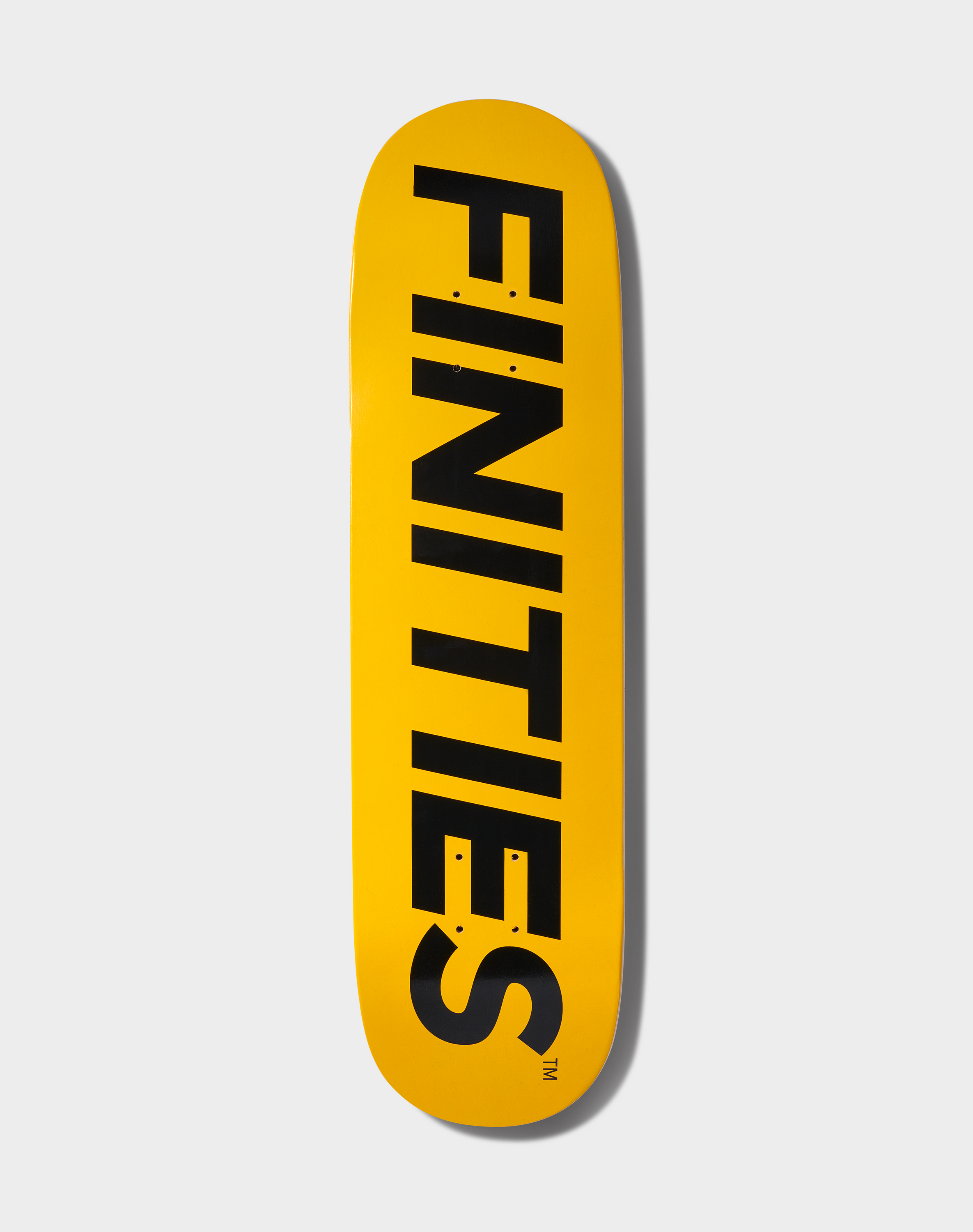 Finities® Logo Skateboard Deck featuring a gold and black logo on a seven-ply Canadian maple construction, dimensions 8" x 31".