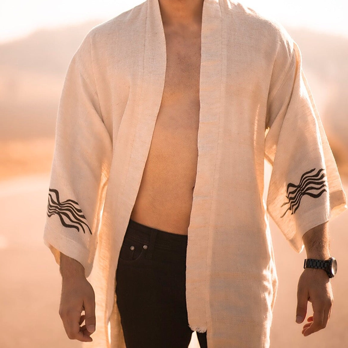 Fire God Linen Kimono featuring handwoven natural linen fabric with intricate patterns and organic dyes.