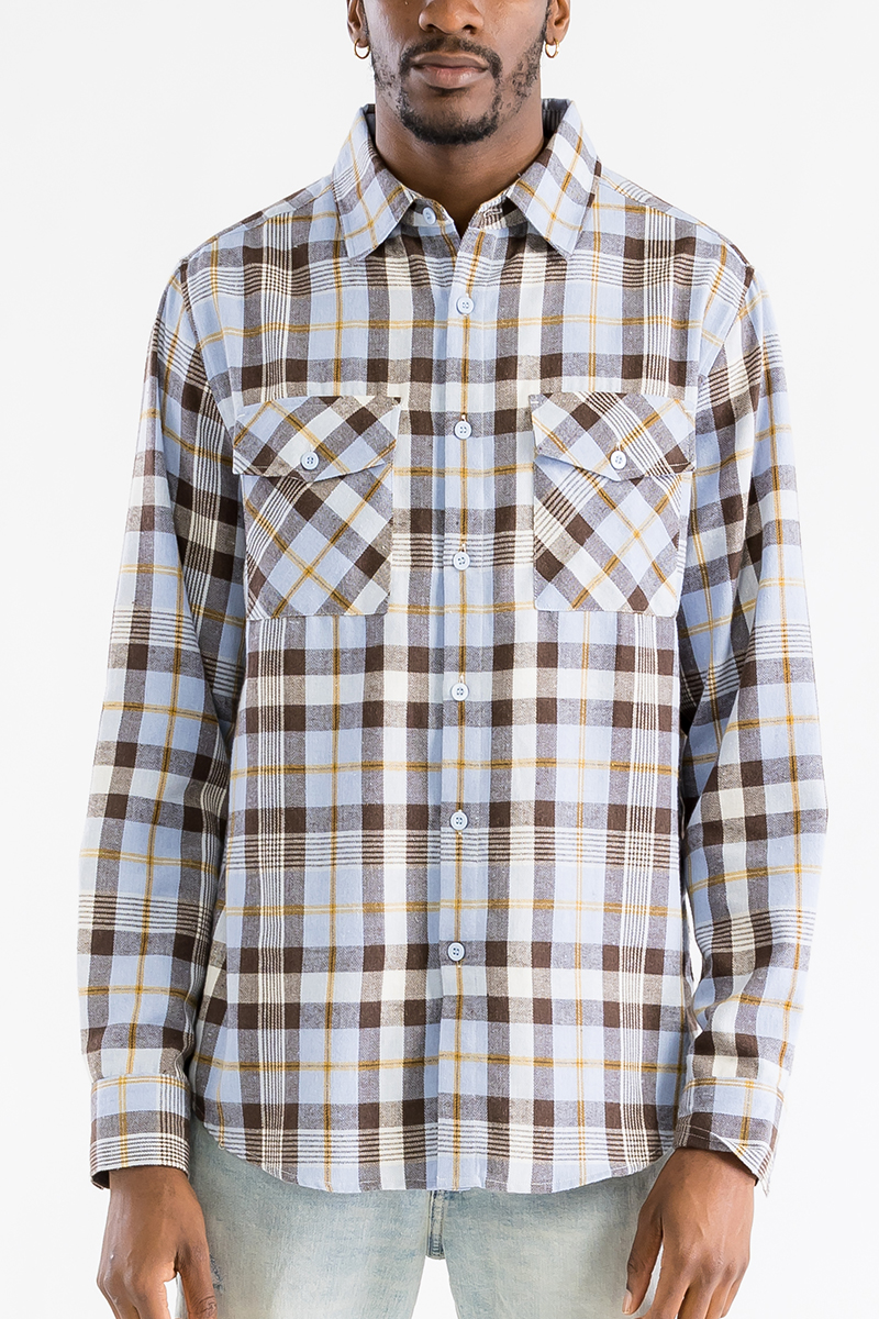 A stylish checkered long sleeve flannel shirt featuring a regular fit, chest pockets, and a curved hem, perfect for casual wear.