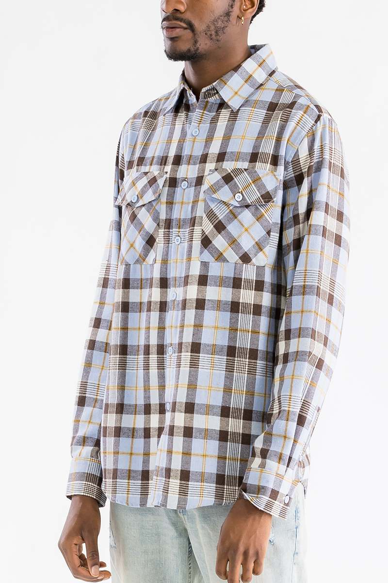 A stylish checkered long sleeve flannel shirt featuring a regular fit, chest pockets, and a curved hem, perfect for casual wear.