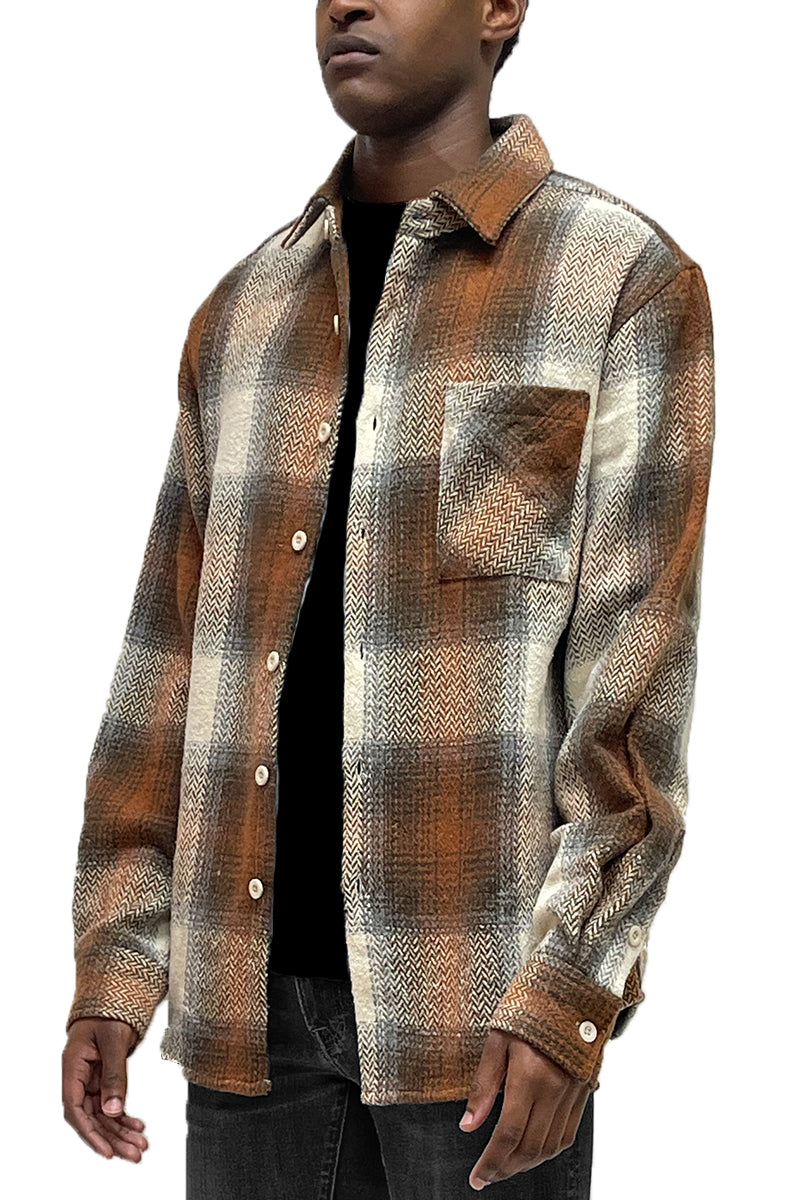 A stylish Flannel Combo Shacket featuring a chest pocket and button closure, perfect for layering in any season.