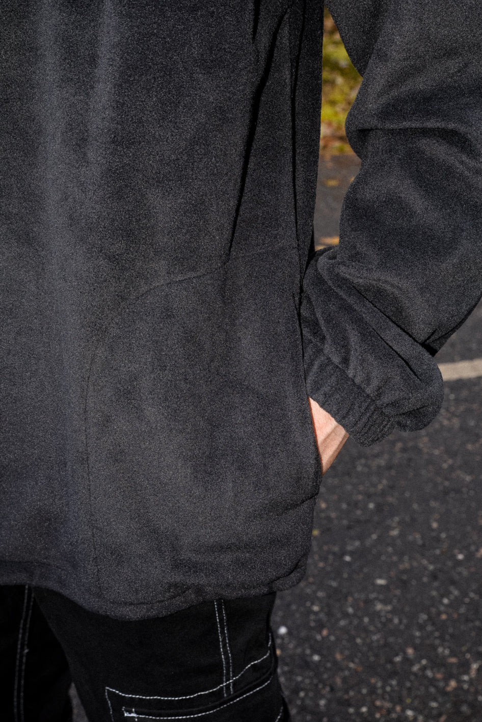 Black fleece with DBDNS Futuristic Logo Embroidery, featuring a 1/4 zip and two front pockets, showcasing a relaxed fit.