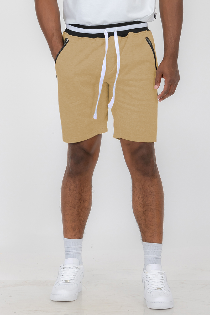 A pair of stylish French Terry Sweat Shorts featuring an elastic waistband, zippered side pockets, and a casual design, perfect for summer wear.