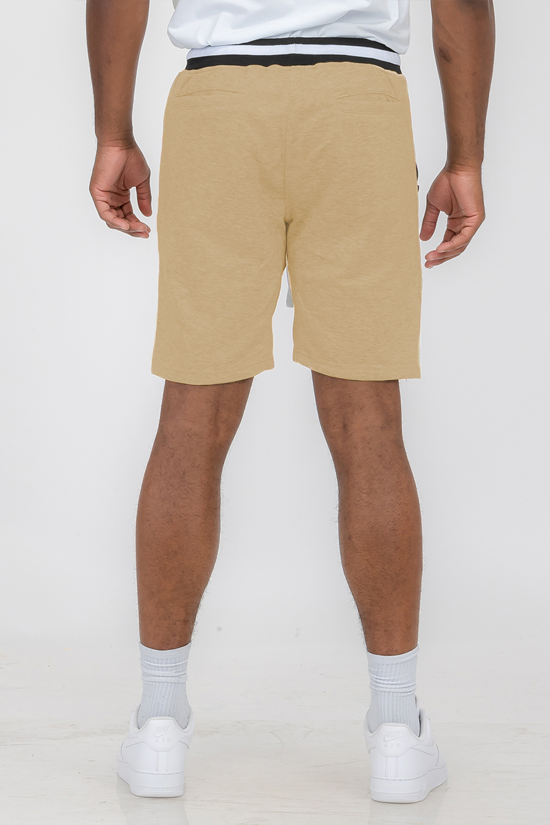 A pair of stylish French Terry Sweat Shorts featuring an elastic waistband, zippered side pockets, and a casual design, perfect for summer wear.