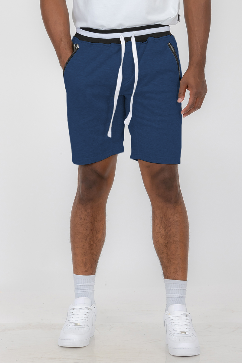 A pair of stylish French Terry Sweat Shorts featuring an elastic waistband, drawstring, and standard pockets, made from soft polyester and spandex blend.