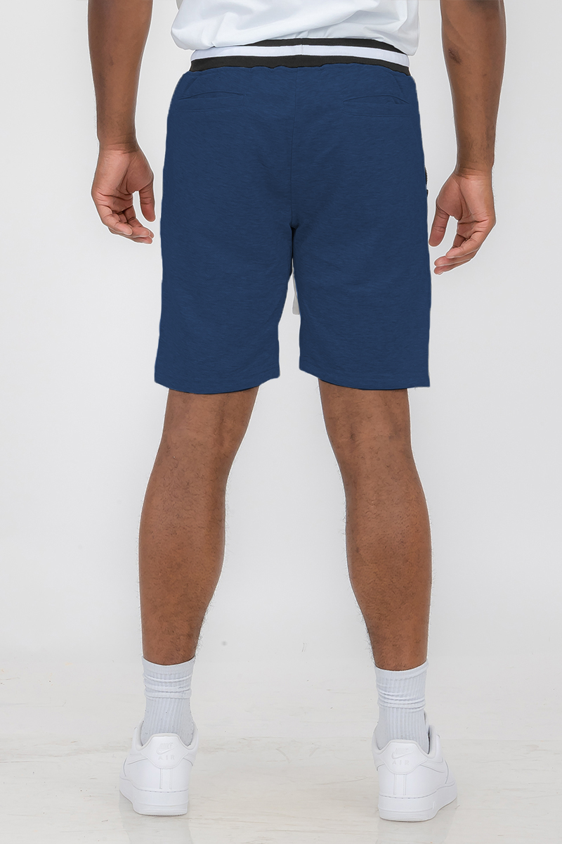 A pair of stylish French Terry Sweat Shorts featuring an elastic waistband, drawstring, and standard pockets, made from soft polyester and spandex blend.