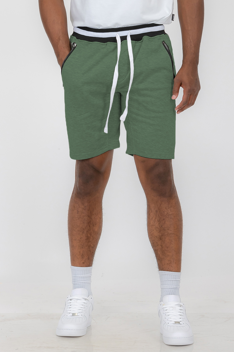 Man in green shorts.