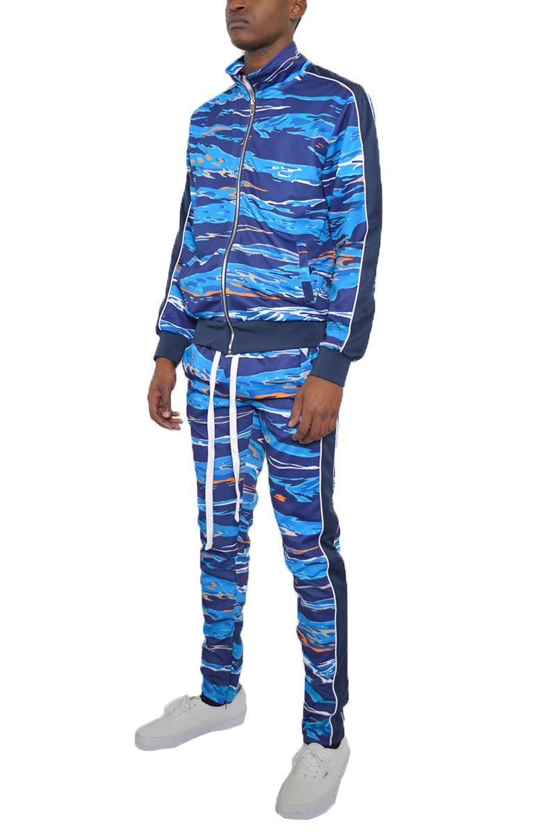 A stylish full print track suit featuring a skinny fit, elastic waist with drawstring, ankle zippers, and pockets, perfect for athletic and casual wear.