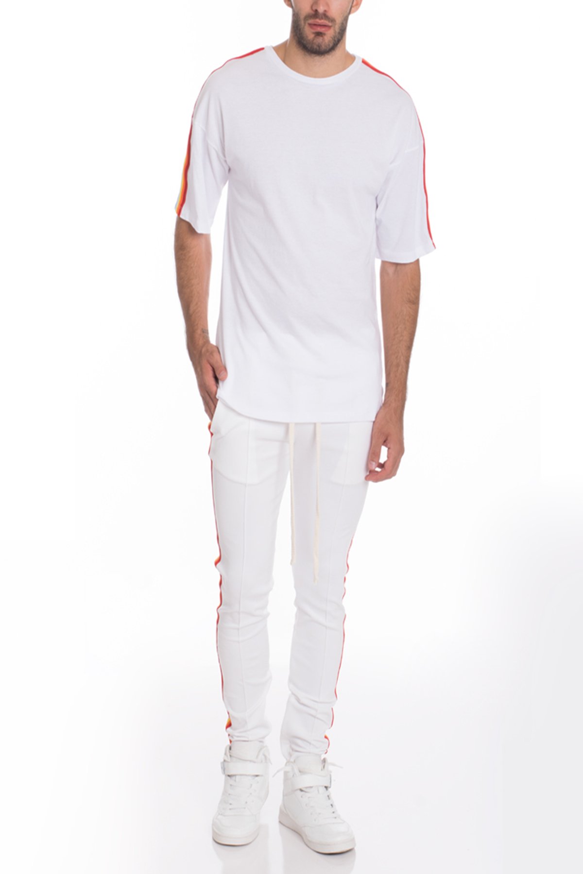 A stylish FULL RAINBOW SET in White, featuring a vibrant rainbow design, made from a soft polyester and spandex blend, modeled by a tall individual.