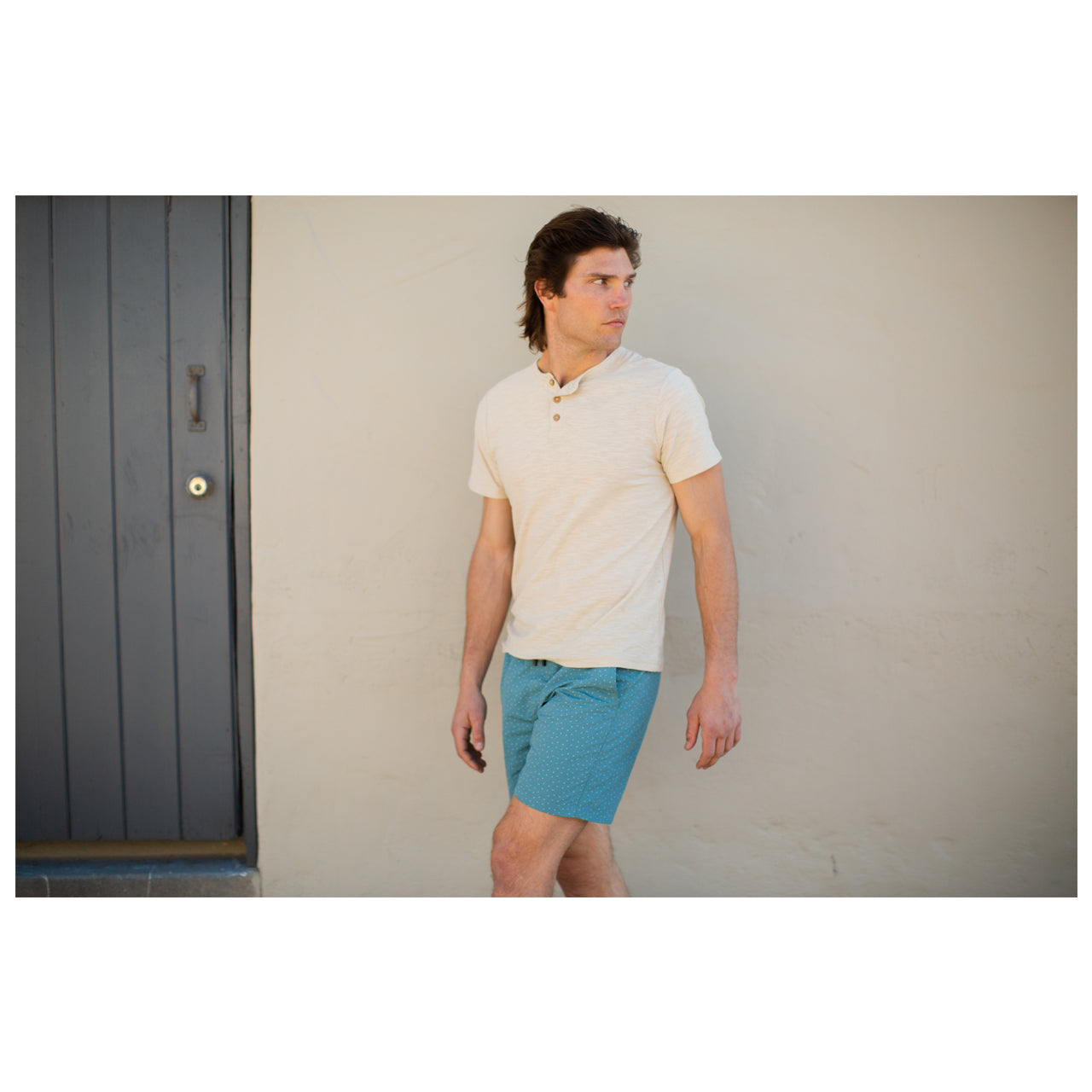 Gabe Solid Slub Henley in sand color, featuring a three-button placket and short sleeves, made from 100% cotton.