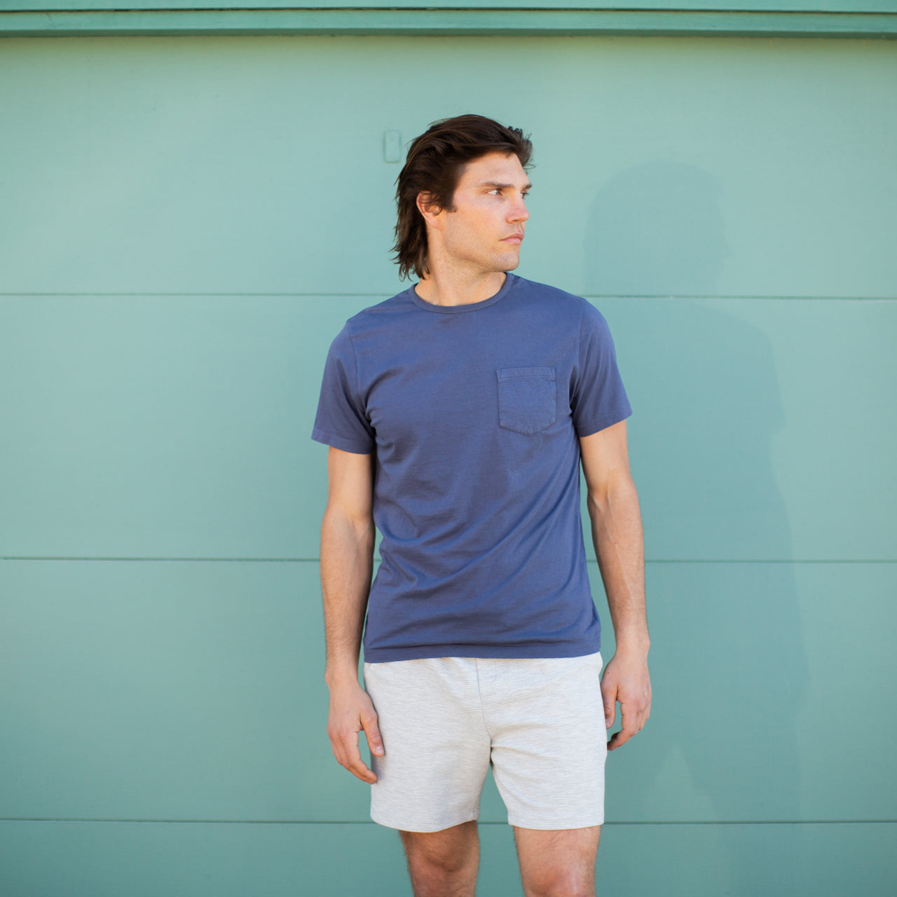 Gavin Garment Dyed Tee in navy color with a patch pocket, showcasing its soft cotton fabric and crew neck design.