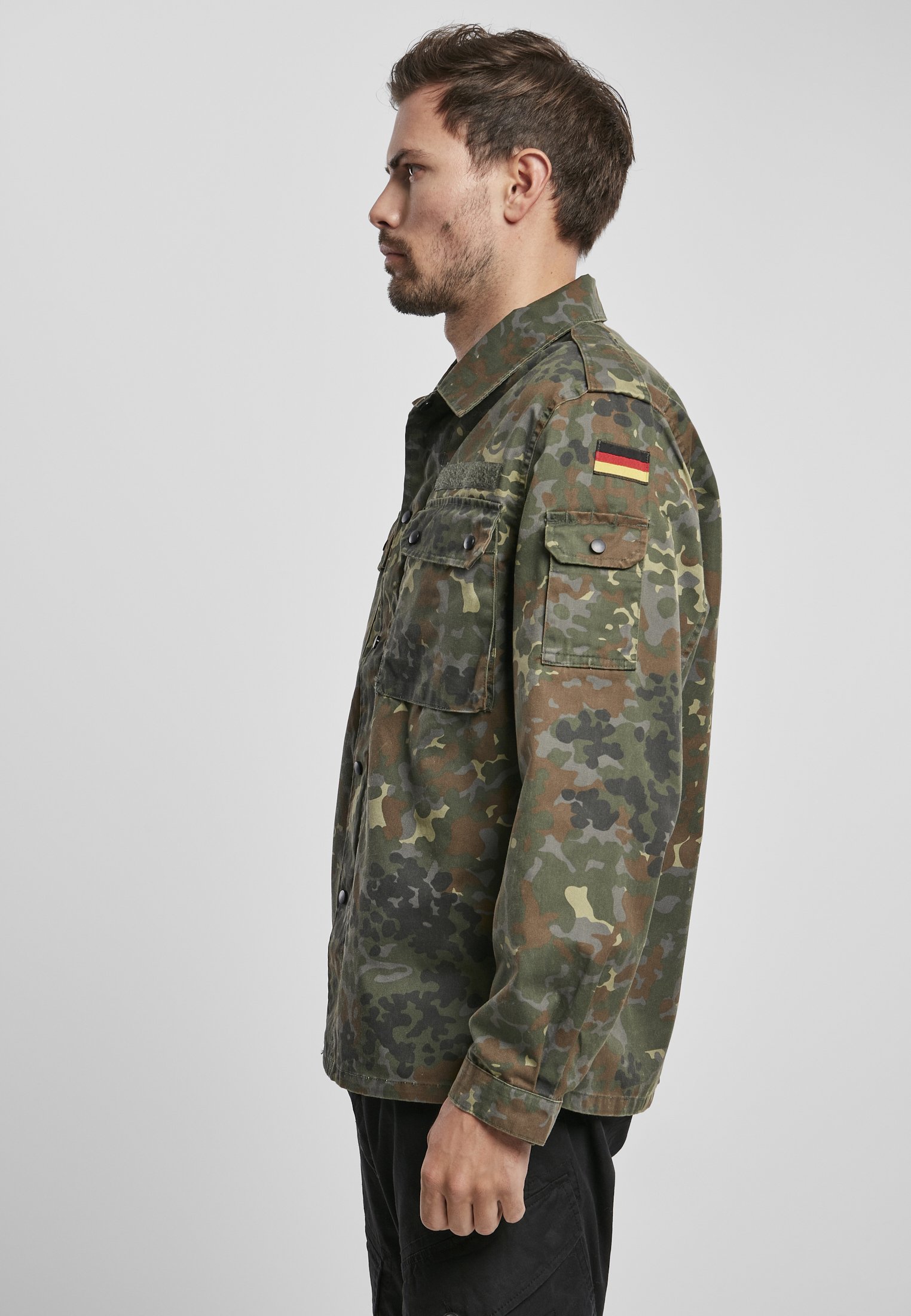 German Forces Military Field Blouse featuring durable fabric, chest pockets, and national emblems.