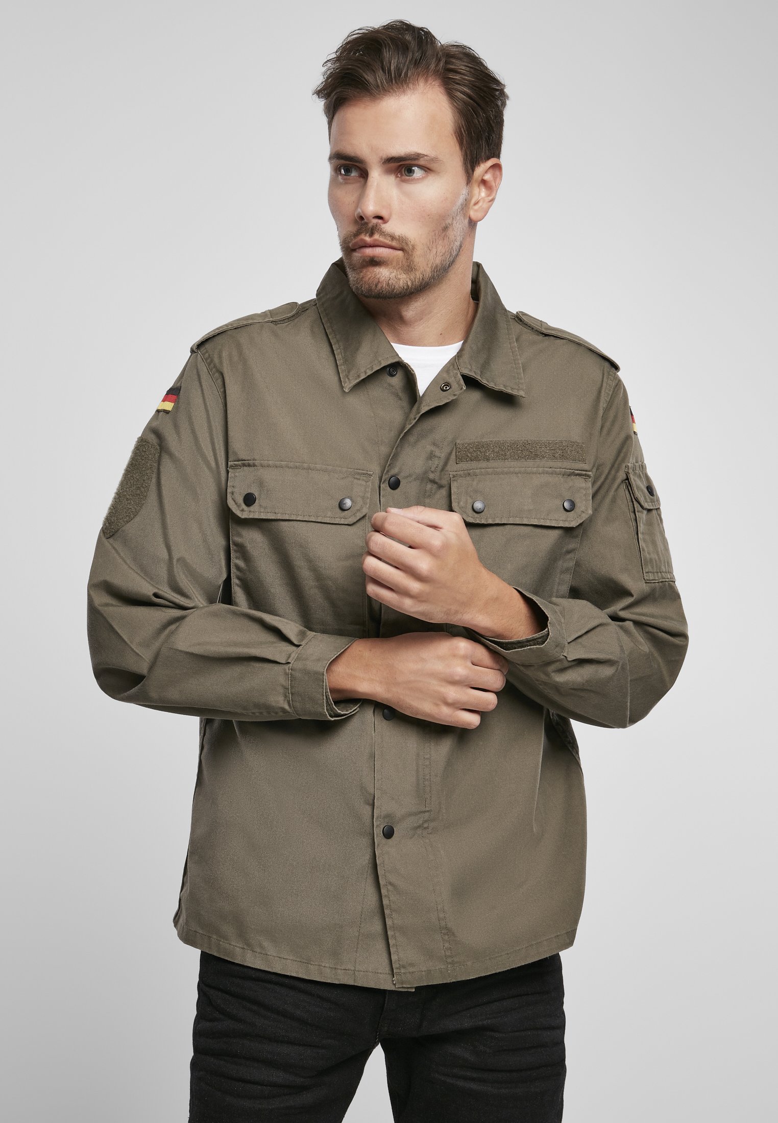 German Forces Military Field Blouse featuring durable fabric, chest pockets, and national emblems.