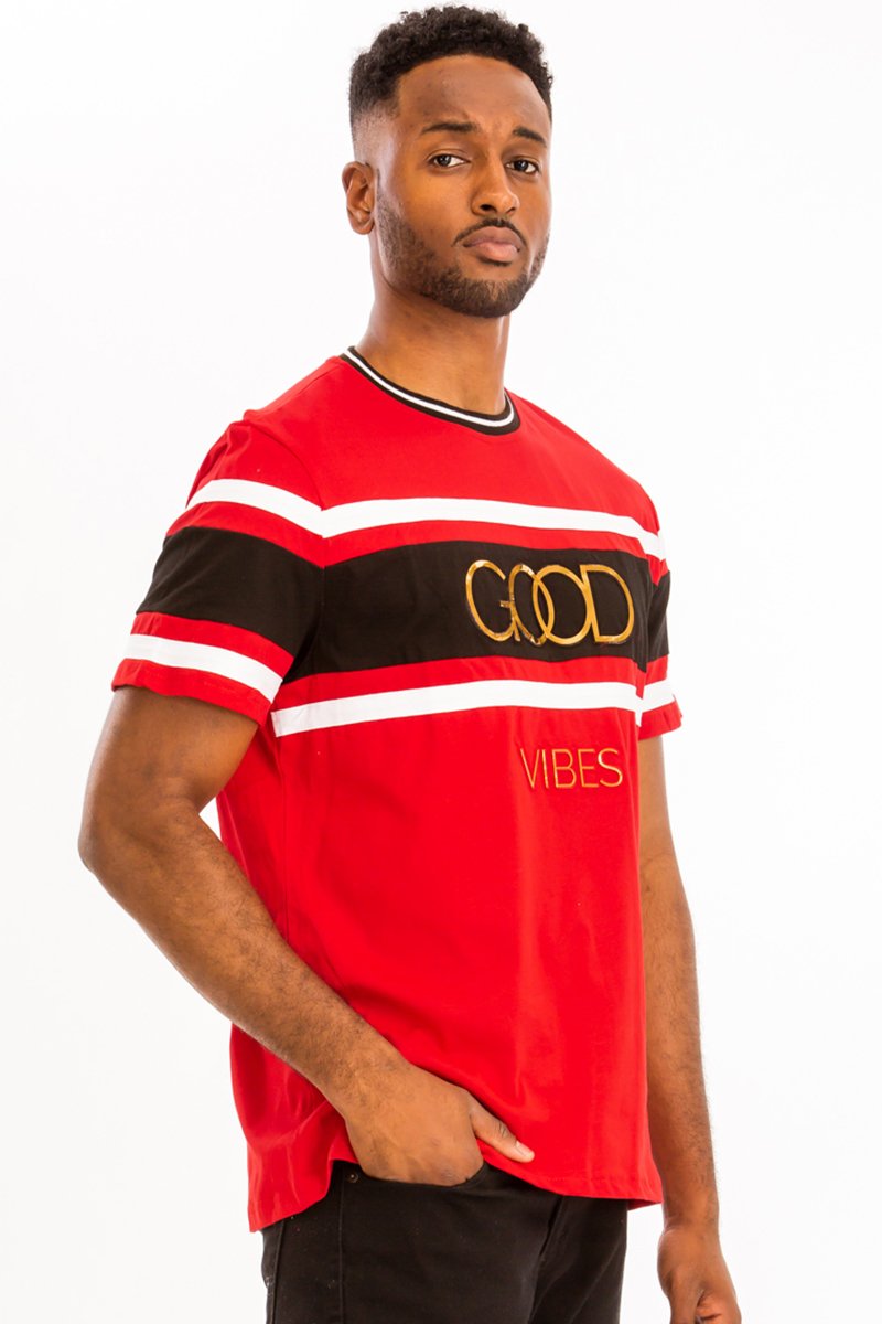 A stylish GOOD VIBES TEE made from 100% cotton, displayed on a mannequin, showcasing its relaxed fit and vibrant design.