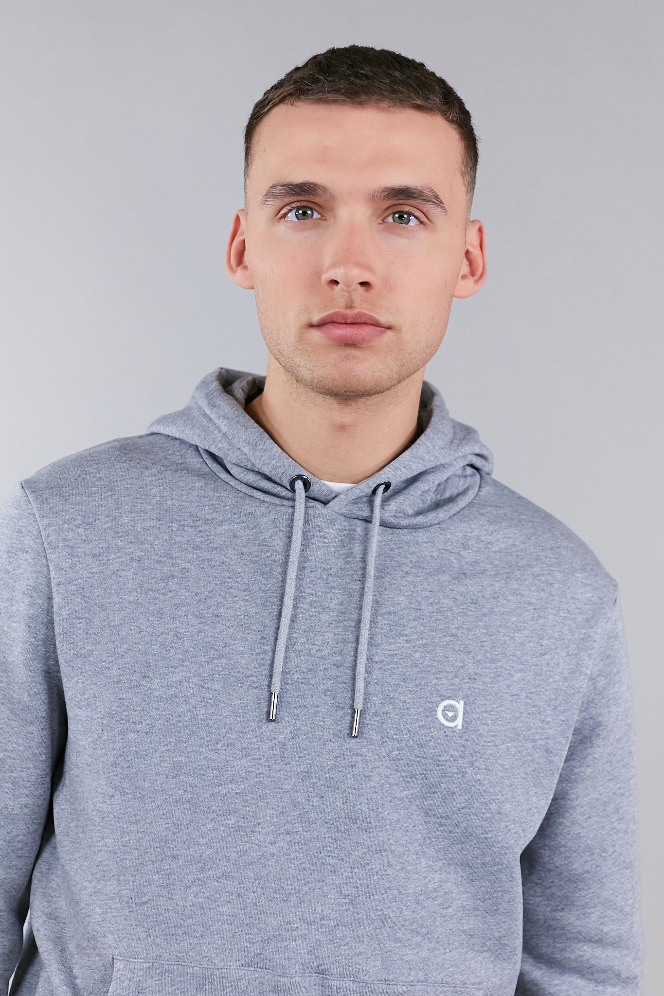 A grey hoodie featuring the altid embroidered logo, made from 100% organic cotton, showcasing a drawstring hood and regular fit.