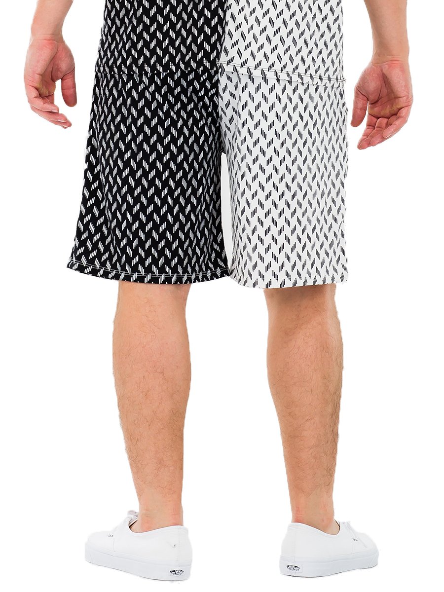 A pair of stylish half and half print shorts featuring a modern design, made from a comfortable polyester and spandex blend.