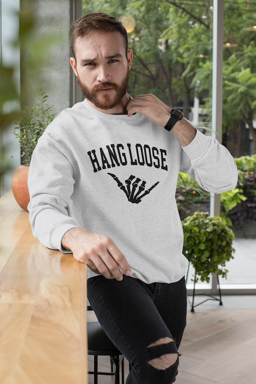 A cozy Hang Loose Sweater featuring a soft cotton face and stylish ribbed details, perfect for casual wear.