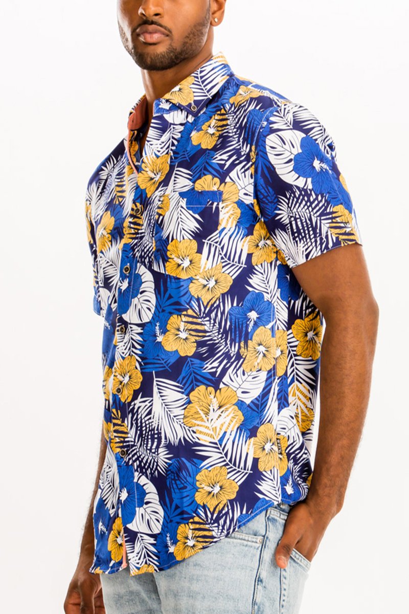 A vibrant Hawaiian button down shirt featuring a unique digital all-over print, showcasing a chest pocket and a regular fit.