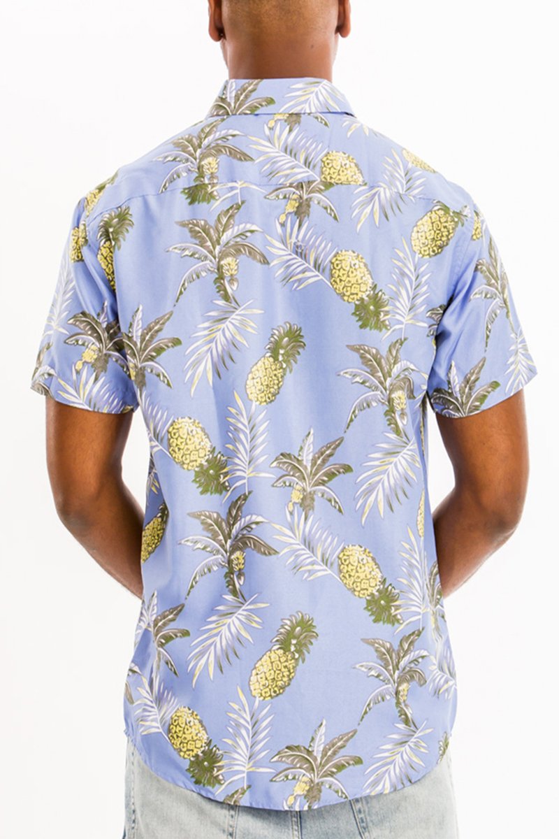 A vibrant Hawaiian button down shirt featuring a unique digital all-over print, showcasing a chest pocket and a regular fit.