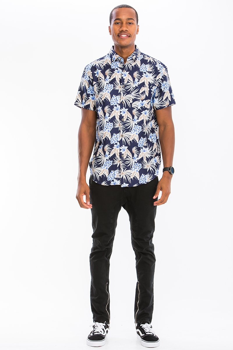 A vibrant Hawaiian button down shirt featuring a unique digital print, chest pocket, and regular fit, perfect for summer outings.