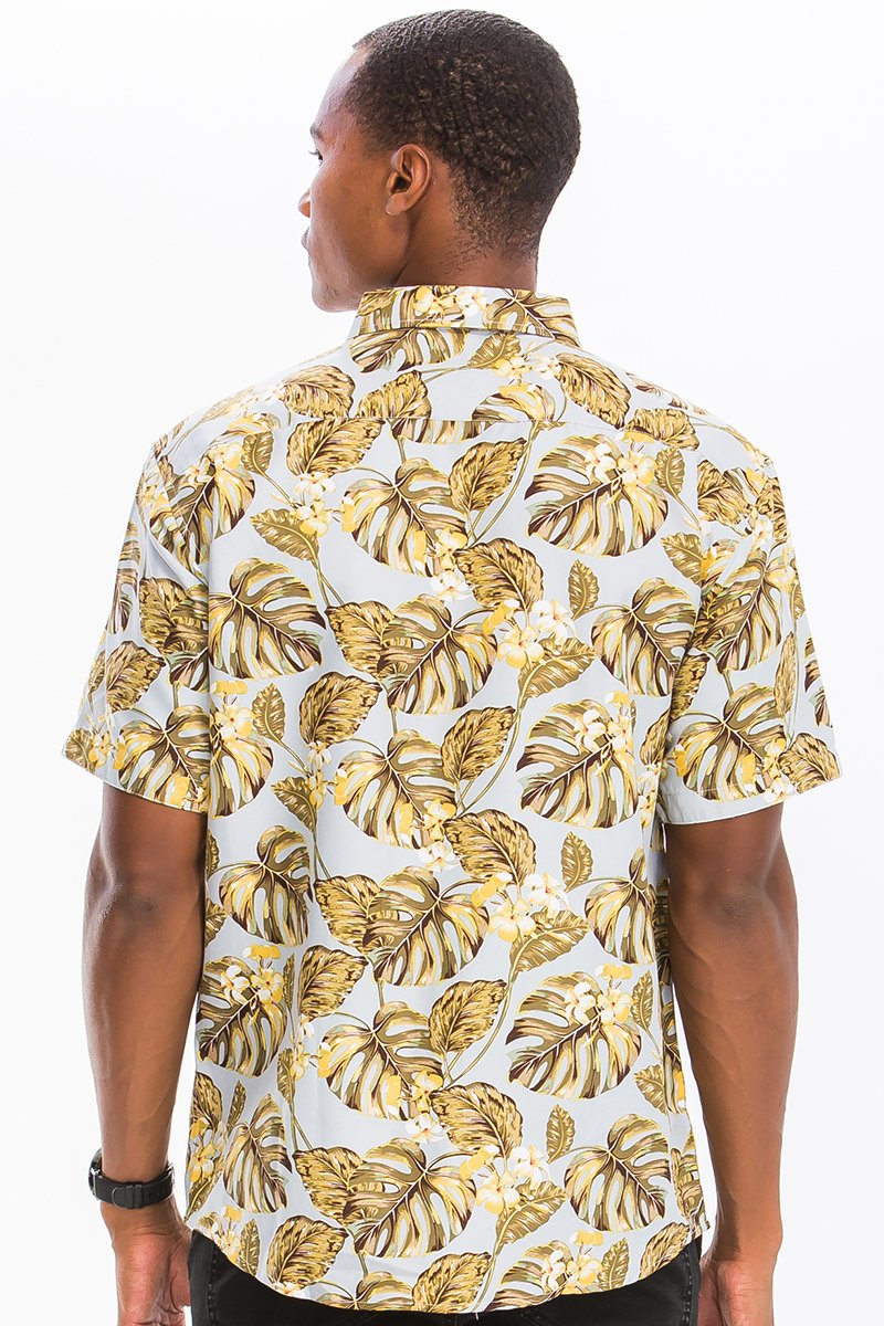 A vibrant Hawaiian button down shirt featuring unique digital prints, showcasing a chest pocket and a regular fit, perfect for summer wear.