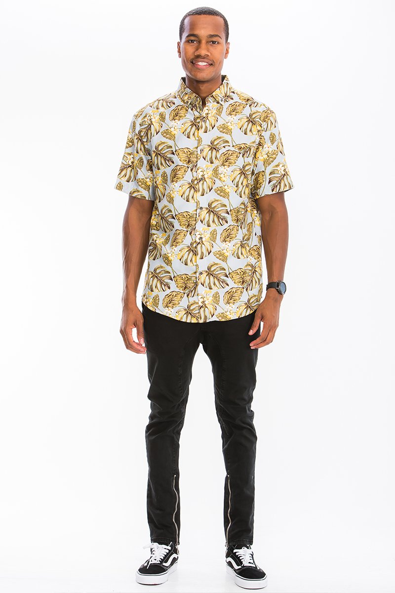 A vibrant Hawaiian button down shirt featuring unique digital prints, showcasing a chest pocket and a regular fit, perfect for summer wear.