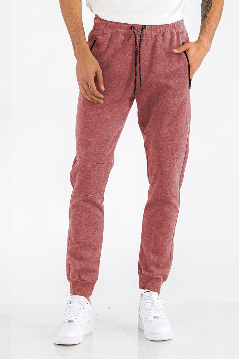 Heathered cotton sweats featuring an elastic waist, ankle cuffs, and a zipper pocket, perfect for casual wear.