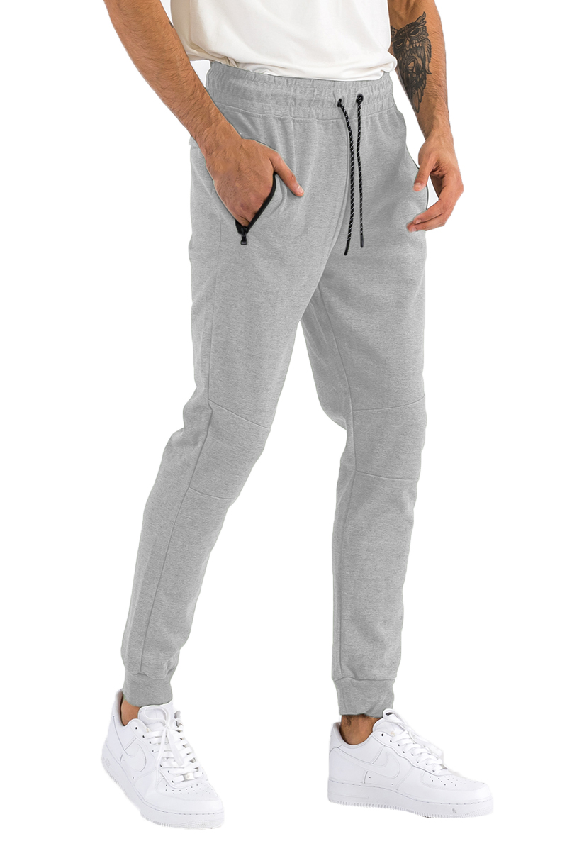 Heathered cotton sweats featuring zippered pockets and elastic waist with drawstring, perfect for casual wear.